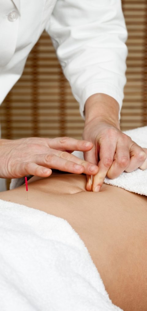 Acupuncturist Performing Abdominal Acupuncture