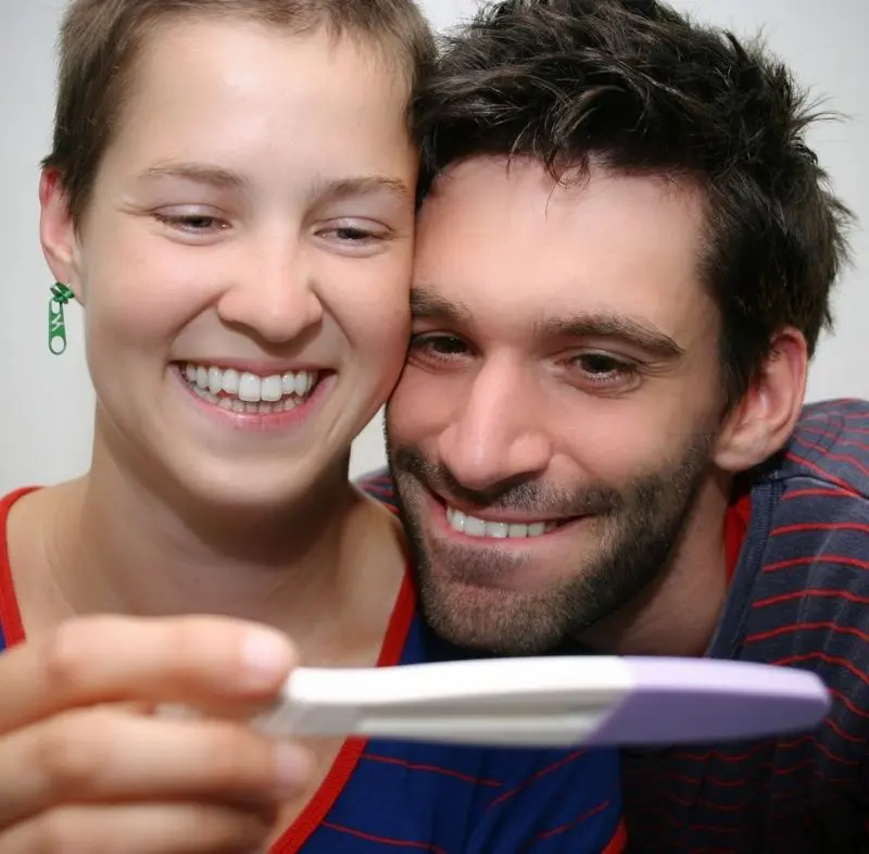 Couple Looking At Pregnancy Test<br />